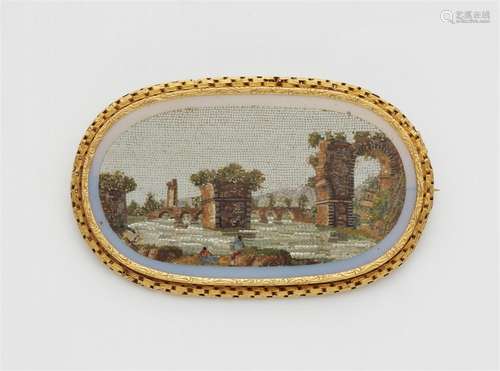 An 18k gold and Roman micromosaic brooch depicting the ruins...