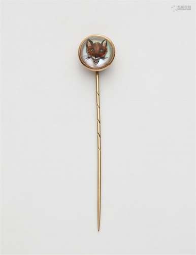 A 14k gold fox tie pin