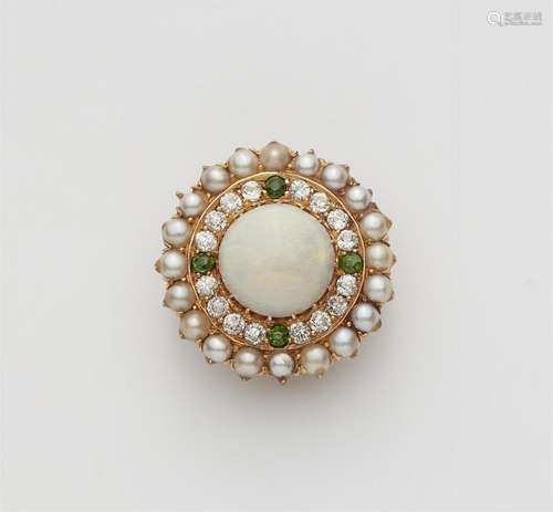 A 14k red and yellow gold opal rosette brooch