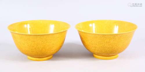 A PAIR OF CHINESE YELLOW GROUND DRAGON TEA BOWLS - each with...