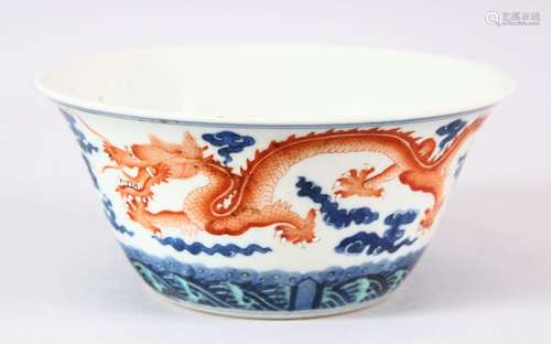 A CHINESE BLUE AND IRON RED PORCELAIN DRAGON BOWL, painted w...