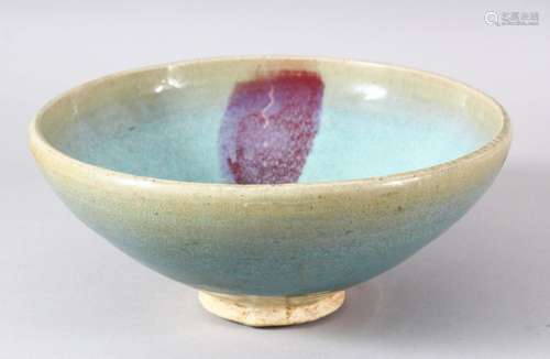 A CHINESE JUNYAO GLAZED POTTERY BOWL, 23.5cm diameter.