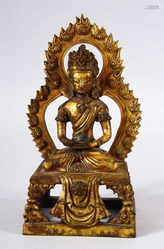 A THAI GILT BRONZE FIGURE of a seated deity, 20cm high.