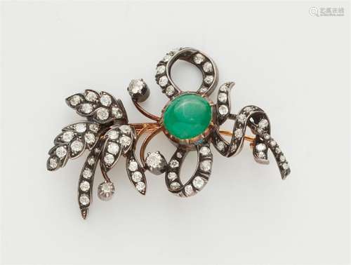 An 18k red gold, silver, emerald and diamond flowering sprig...