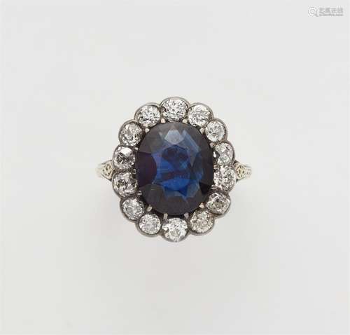 A 14k gold and silver sapphire cluster ring