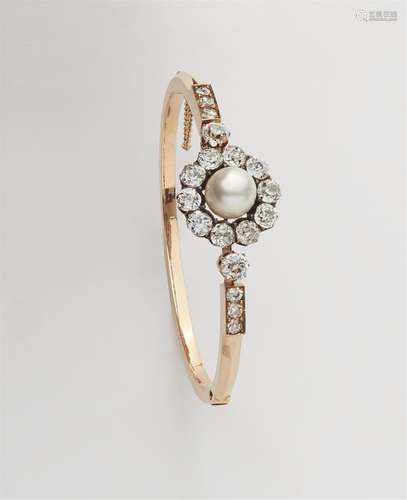 A Belle Epoque 18k red gold pearl and diamond bangle