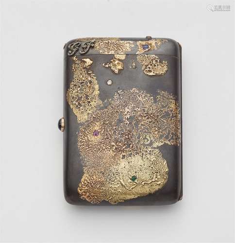 A Japonisme style gold and gun metal cigarette case