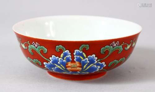 A CHINESE RED GROUND PORCELAIN BOWL, the exterior painted wi...