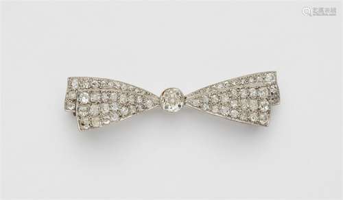 A platinum diamond bow brooch