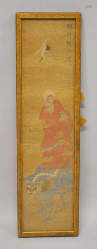 A JAPANESE PAINTED TEXTILE PICTURE OF A ARHAT HOLDING HIS BO...