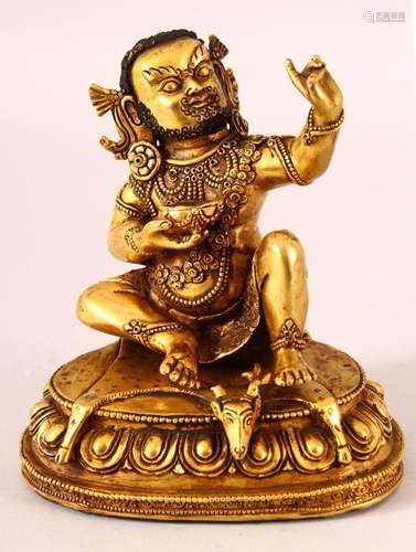 A CHINESE GILT BRONZE FIGURE OF A DEITY, in two parts, seate...