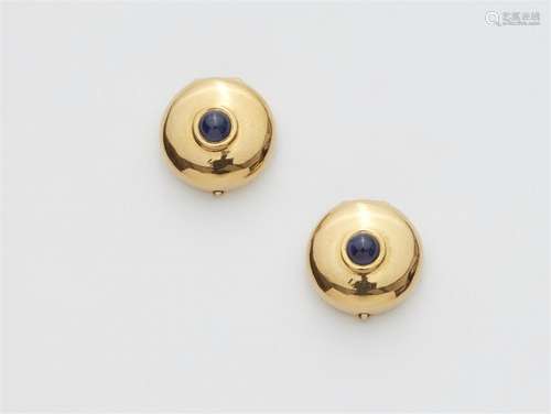 A pair of 18k gold and sapphire button covers