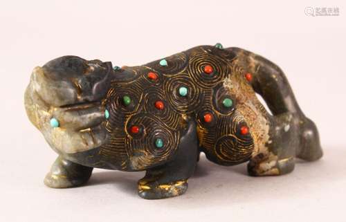 AN INDIAN CARVED AND GILDED INLAID JADE FIGURE of a buffalo,...