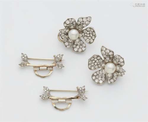 A pair of convertible platinum diamond and pearl clip earrin...