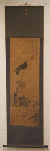 A CHINESE PAINTED SCROLL OF BIRD in flora, signed and sealed...