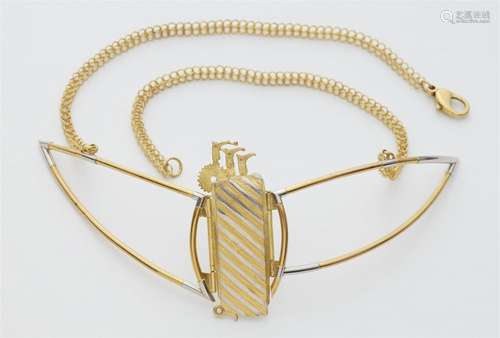 An 18k gold and platinum necklace with a foot motif