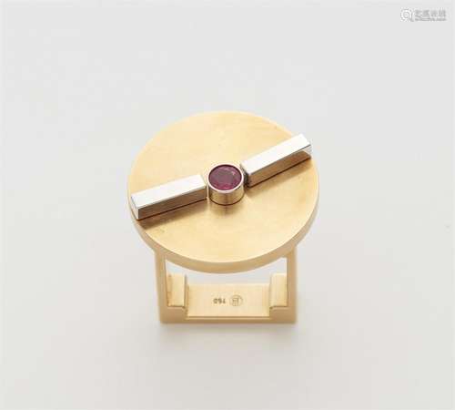 An 18k bi-colour gold and ruby kinetic ring