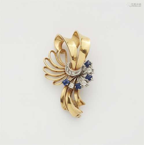 An 18k gold sapphire retro clip brooch