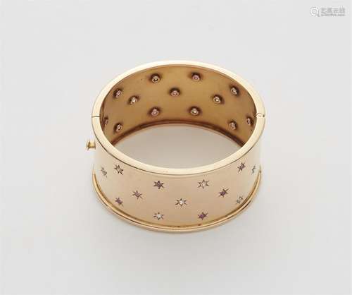 An 18k rose gold gemstone cuff bangle