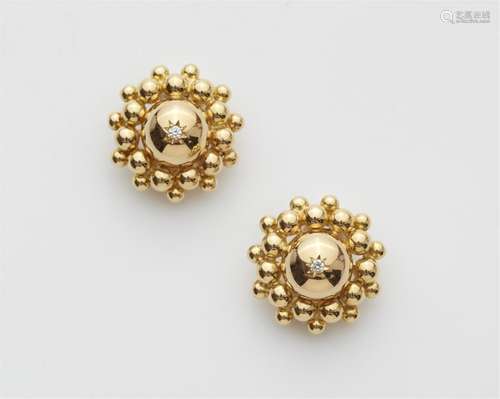 A pair of 14/18k gold clip earrings