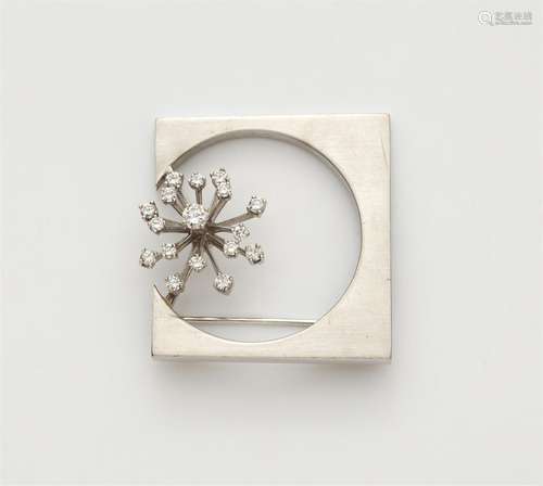 An 18k white gold diamond brooch