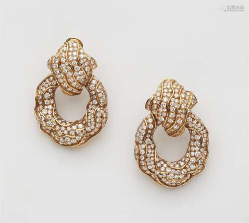 A pair of 18k gold and diamond clip earrings