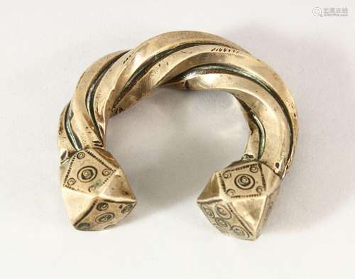 A SEJLUK WHITE METAL TWISTED BANGLE, The lower with a hall m...