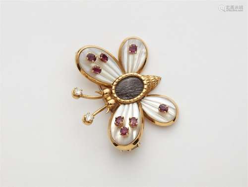 An 18k gold mother-of-pearl and ruby butterfly brooch