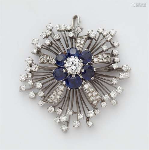 An 18k gold diamond and sapphire flower brooch