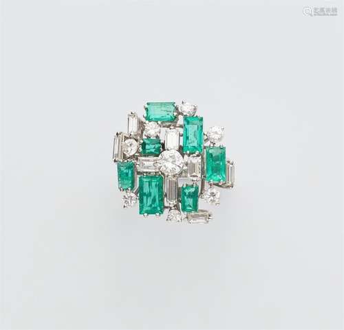 An 18k white gold emerald ring