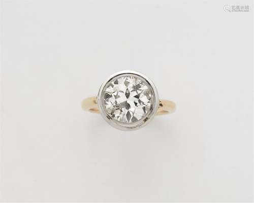 A 14k gold and platinum solitaire ring with a European old-c...