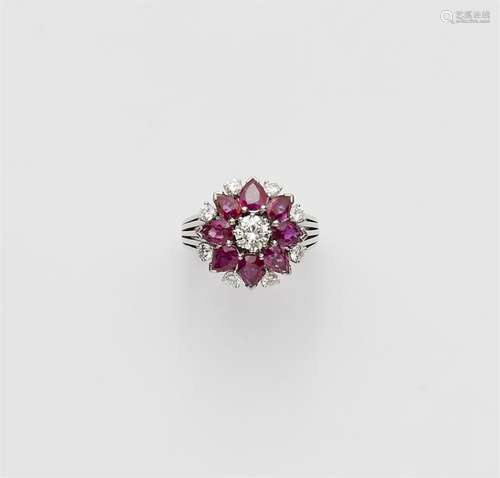 An 18k white gold ruby flower ring