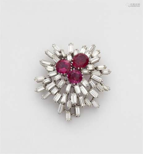 A platinum and diamond clip brooch with three natural Burmes...