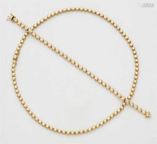 An 18k gold diamond rivière necklace and bracelet