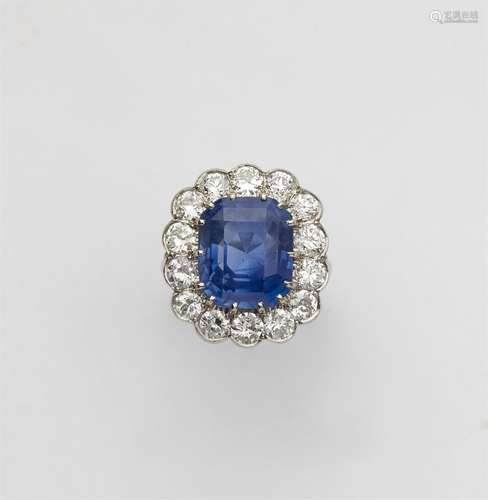 A platinum diamond and natural Ceylon sapphire cluster ring