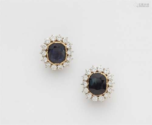 A pair of platinum and gold sapphire clip earrings