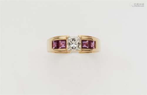 An 18k gold ruby and diamond solitaire ring