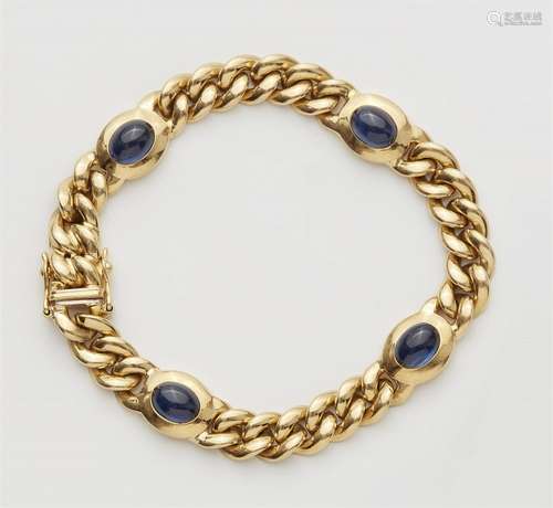 An 18k gold chain bracelet with sapphires