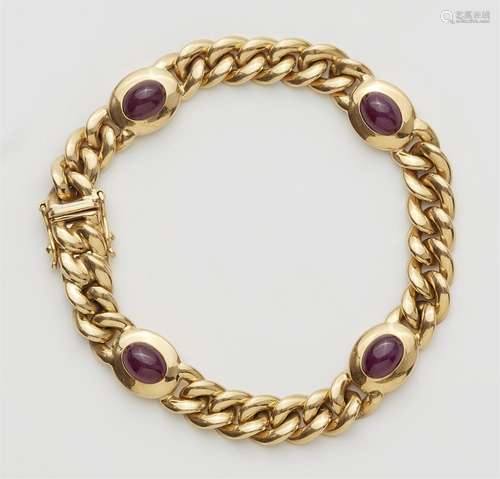 An 18k gold chain bracelet with rubies