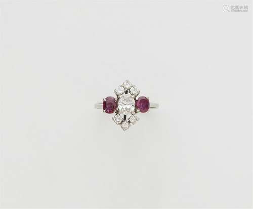 A 14k white gold diamond and ruby ring