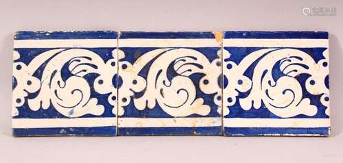 THREE ISLAMIC BLUE AND WHITE TILES, each approx. 13cm square...