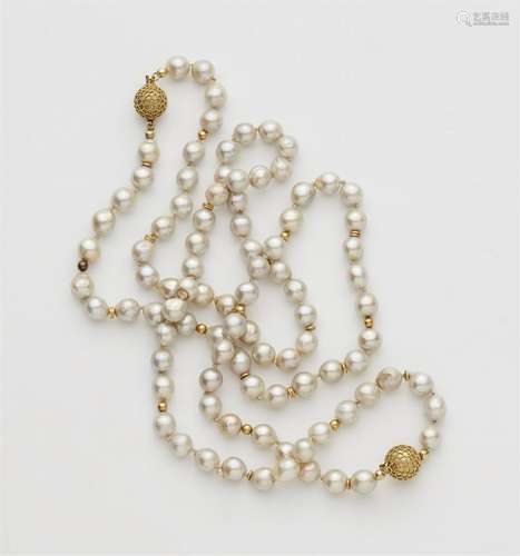 A pair of pearl necklaces with 18k gold granulation clasps