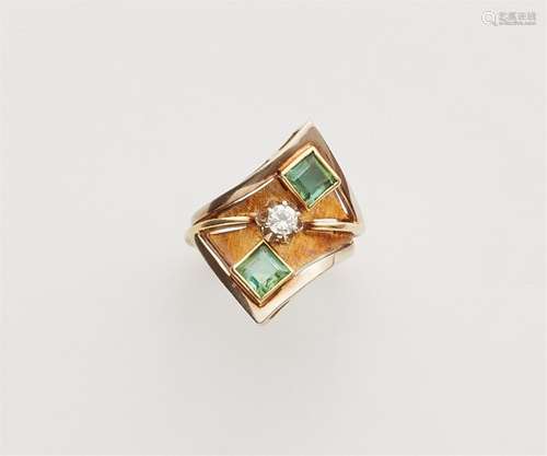 A 14k gold emerald ring