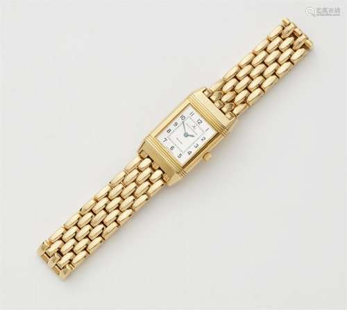 An 18k gold Reverso Lady Quartz wrist watch with box and pap...