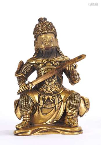 A Gilt Bronze Figure of Buddhist Guardian King