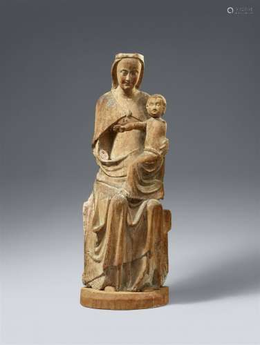 A carved wood figure of the Virgin Enthroned, presumably Maa...