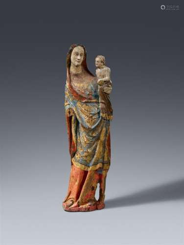 A mid-14th century figure of the Virgin and Child, presumabl...