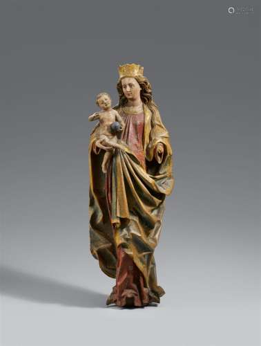 A carved wooden figure of the Virgin and Child, presumably U...