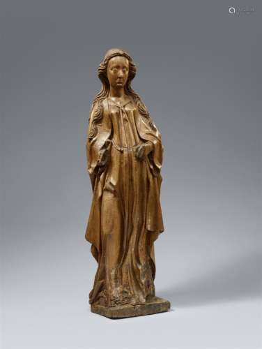 A carved oak figure of a female saint, probably Saint Cather...