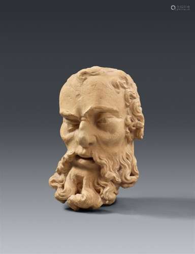 An early 16th century carved sandstone head of a bearded man...